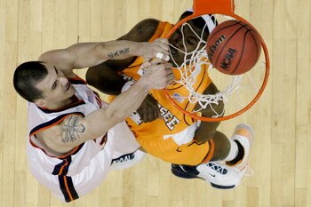 COLUMBUS, OH - MARCH 18:  Jason Cain #33 of the Virginia Cavaliers misses a dunk over Wayne Chism #4  of the Tennessee Volunteers during the second round of the NCAA Men's Basketball Tournament at Nationwide Arena on March 18, 2007 in Columbus, Ohio.  (Ph