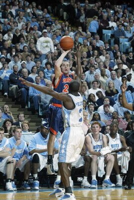 CHAPEL HILL, NC - FEBRUARY 12:  Todd Billet #22 of the University of Virginia Cavaliers shoots over Raymond Felton #2 of the University of North Carolina at Chapel Hill Tar Heels during the game at Dean E. Smith Center on February 12, 2003 in Chapel Hill,
