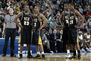 BUFFALO, NY - MARCH 17:  Jesse Pellot-Rosa #23, Eric Maynor #3, Calvin Roland #30 and Michael Anderson #15 of the Virginia Commonwealth Rams stand on the court against the Pittsburgh Panthers during round two of the NCAA Men's Basketball Tournament at HSB