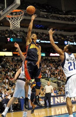 DALLAS - JANUARY 28: Guard Monta Ellis #8 of the Golden State Warriors takes a shot against the Dallas Mavericks on January 28, 2009 at American Airlines Center in Dallas, Texas. NOTE TO USER: User expressly acknowledges and agrees that, by downloading an