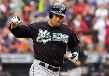 NEW YORK - SEPTEMBER 27:  John Baker #21 of the Florida Marlins reacts after flying out to end the fifth inning with the bases loaded against the New York Mets on September 27, 2008 at Shea Stadium in the Flushing neighborhood of the Queens borough of New