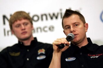 CONCORD, NC - JANUARY 20:  Jason Leffler (R), driver of the Great Clips Toyota, speaks as Steven Wallace (L), driver of the 5 hour Energy Chevrolet looks on, during the NASCAR Nationwide Series press conference, held during the NASCAR Sprint Media Tour, h