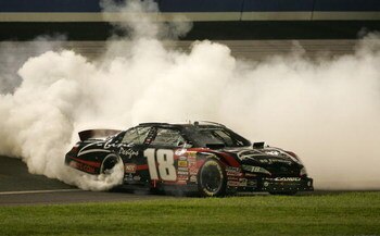 FONTANA, CA - FEBRUARY 21:  Kyle Busch, driver of the #18 Z-Line Designs Toyota, performs a burnout to celebrate winning the NASCAR Nationwide Series Stater Bros. 300 at Auto Club Speedway on February 21, 2009 in Fontana, California.  (Photo by Todd Warsh