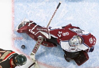 DENVER - APRIL 19:  Goalie Patrick Roy #33 of the Colorado Avalanche stops a shot by Marian Gaborik #10 of the Minnesota Wild during game five of the first round of the 2003 Western Conference Stanley Cup playoffs on April 19, 2003 at the Pepsi Center in 