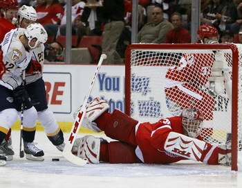 DETROIT - APRIL 10: Dominik Hasek #39 of the Detroit Red Wings makes a save while losing his stick behind Scott Nichol #12 of the Nashville Predators during game one of the 2008 NHL Western Conference Quarterfinals on April 10, 2008 at Joe Louis Arena in 