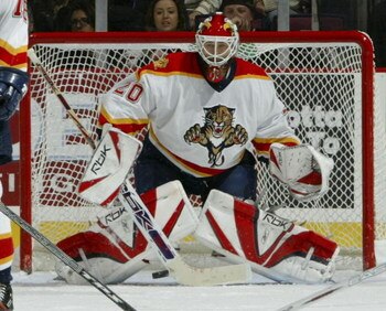 EAST RUTHERFORD, NJ - NOVEMBER 11:  Goaltender Ed Belfour #20 of the Florida Panthers prepares to make a save during their game against the New Jersey Devils at the Continental Airlines Arena on November 11, 2006 in East Rutherford, New Jersey.  (Photo by
