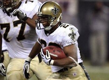 CHICAGO - DECEMBER 11:  Pierre Thomas #23 of the New Orleans Saints runs the ball against the Chicago Bears at Soldier Field on December 11, 2008 in Chicago, Illinois.  (Photo by Jonathan Daniel/Getty Images)