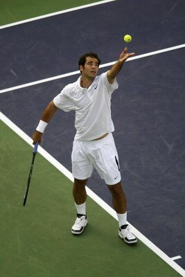13 Mar 2002:  Pete Sampras of the USA tosses up the ball for a serve to Albert Costa of Spain during the Pacific Life Open at the Indian Wells Tennis Garden in Indian Wells, California.  Sampras won 6-4, 6-4.  DIGITAL IMAGE Mandatory Credit: Brian Bahr/Ge