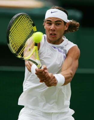 LONDON - JULY 06:  Rafael Nadal of Spain plays a backhand during the Men's Singles quarter-final match against Tomas Berdych of the Czech Republic during day eleven of the Wimbledon Lawn Tennis Championships at the All England Lawn Tennis and Croquet Club