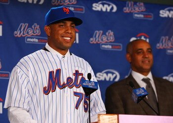 LONG ISLAND CITY, NY - DECEMBER 17:  Francisco Rodriquez of the New York Mets speaks to the media as General Manager Omar Minaya looks on during a press conference to introduce Rodriquez on December 17, 2008 at the Citigroup Building in New York City.  (P