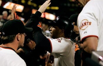 SAN FRANCISCO - AUGUST 9:  Dave Roberts #10 of the San Francisco Giants celebrates with teammates after scoring the tying run in the 10th inning against the Los Angeles Dodgers at AT&T Park on August 9, 2008 in San Francisco, California. (Photo by Max Mor