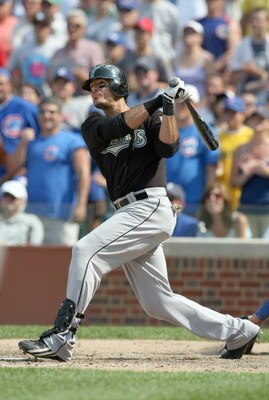 CHICAGO - JULY 26:  Jorge Cantu #3 of the Florida Marlins connects with the pitch during the game against the Chicago Cubs on July 26, 2008 at Wrigley Field in Chicago, Illinois. (Photo by Jonathan Daniel/Getty Images) 