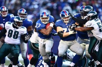 EAST RUTHERFORD, NJ -  JANUARY 11:  Brandon Jacobs #27 of the New York Giants runs the ball against the Philadelphia Eagles during the NFC Divisional Playoff Game on January 11, 2009 at Giants Stadium in East Rutherford, New Jersey.  The Eagles defeated t