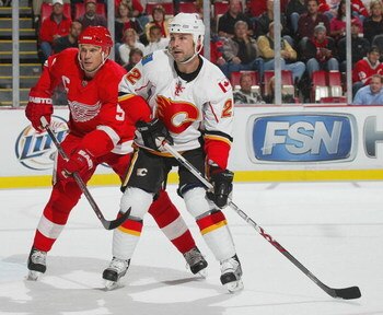 DETROIT - OCTOBER 10:  Niklas Lidstrom #5 of the Detroit Red Wings defends against Daymond Langkow #22 of the Calgary Flames in a game on October 10, 2007 at the Joe Louis Arena in Detroit, Michigan. The Red Wings defeated the Flames 4-2. (Photo by Claus 