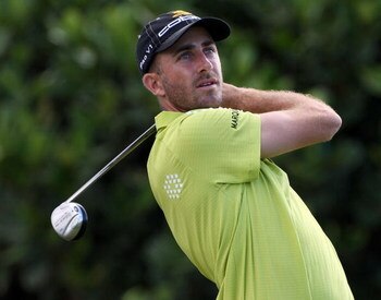 KAPALUA, HI - JANUARY 08:  Geoff Ogilvy of Australia plays a shot during the first round of the Mercedes-Benz Championship at the Plantation Course on January 8, 2009 in Kapalua, Maui, Hawaii.  (Photo by Sam Greenwood/Getty Images)