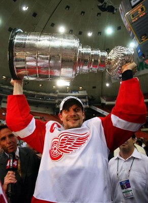 PITTSBURGH - JUNE 04: Nicklas Lidstrom #5 of the Detroit Red Wings celebrates with the Stanley Cup after defeating the Pittsburgh Penguins in game six of the 2008 NHL Stanley Cup Finals at Mellon Arena on June 4, 2008 in Pittsburgh. Pennsylvania. The Red 