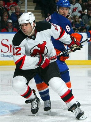 UNIONDALE, NY - FEBRUARY 21:  Brian Rolston #12 of the New Jersey Devils skates against the New York Islanders on February 21, 2009 at Nassau Coliseum in Uniondale, New York. The Isles shutout the Devils 4-0.  (Photo by Jim McIsaac/Getty Images)