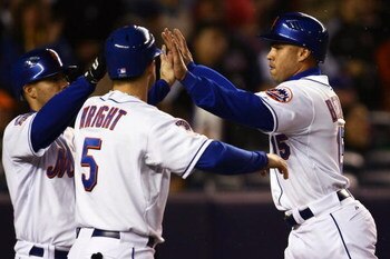 NEW YORK - SEPTEMBER 25: Carlos Beltran #15 of the New York Mets and David Wright #5 celebrate a two-run double hit by Ryan Church #19 against the Chicago Cubs during the MLB game against the Chicago Cubs at Shea Stadium September 25, 2008 in the Flushing