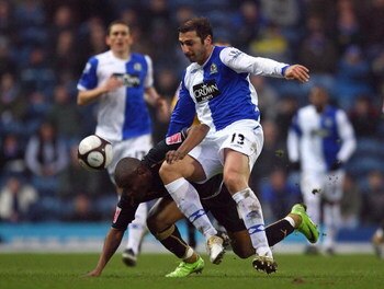 BLACKBURN, UNITED KINGDOM - FEBRUARY 14:  Zurab Khizanishvili (R) of Blackburn Rovers tackles Clinton Morrison of Coventry City during the FA Cup 5th Round match sponsored by e.on between Blackburn Rovers and Coventry City at Ewood Park on February 14, 20