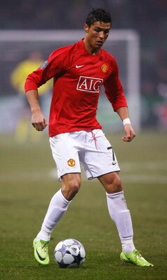 MILAN, ITALY - FEBRUARY 24:  Cristiano Ronaldo of Manchester United runs with the ball during the UEFA Champions League, Round of Last 16, First Leg match between Inter Milan and Manchester United at the San Siro Stadium on February 24, 2009 in Milan, Ita