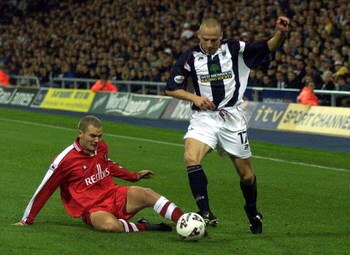 9 Oct 2001:  Larus Sigurdsson of West Brom is challenged by Jonaton Johansson of Charlton during the Worthington Cup, Third Round game between West Bromwich Albion and Charlton Athletic at The Hawthorns, West Bromwich.  DIGITAL IMAGE.  Mandatory Credit:Mi