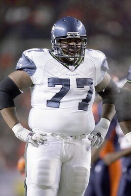 DENVER - DECEMBER 3:  Floyd Womack #77 of the Seattle Seahawks stands on the field during the game against the Denver Broncos on December 3, 2006 at Invesco Field at Mile High in Denver, Colorado. The Seahawks defeated the Broncos, 23-20. (Photo by Brian 
