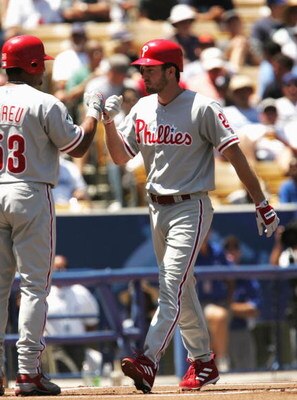 LOS ANGELES - AUGUST 8:  Chase Utley #26 of the Philadelphia Phillies is congratulated at home plate by Boby Abreu #53 after Utley hits a home run in the first inning against the Los Angeles Dodgers on August 8, 2004 at Dodger Stadium in Los Angeles, Cali