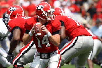 ATHENS, GA - AUGUST 30:  Quarterback Joe Cox #14 of the Georgia Bulldogs takes a snap and looks to hand the ball off during the game against the Georgia Southern Eagles at Sanford Stadium on August 30, 2008 in Athens, Georgia.  The Bulldogs defeated the E