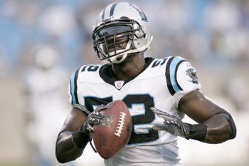 CHARLOTTE, NC - AUGUST 24: Jon Beason #52 of the Carolina Panthers carries the ball before the preseason NFL game against the New England Patriots at Bank of America Stadium August 24, 2007, in Charlotte, N.C. (Photo by Grant Halverson/Getty Images)