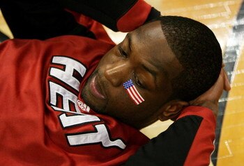 CHICAGO - FEBRUARY 12:  Dwyane Wade #3 of the Miami Heat wears an American Flag bandage on his face as he stretches before a game against the Chicago Bulls on February 12, 2009 at the United Center in Chicago, Illinois. NOTE TO USER: User expressly acknow