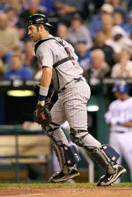 KANSAS CITY, MO - MAY 28:  Catcher Joe Mauer #7 of the Minnesota Twins moves for the loose ball against the Kansas City Royals on May 28, 2008 at Kauffman Stadium in Kansas City, Missouri. (Photo by G. Newman Lowrance/Getty Images)