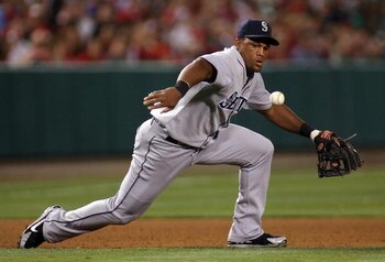 ANAHEIM, CA - AUGUST 12:  Infielder Adrian Beltre #29 of the Seattle Mariners bobbles the ball before fielding a ground ball out against the Los Angeles Angels of Anaheim during the game at Angel Stadium on August 12, 2008 in Anaheim, California. The Ange