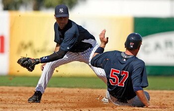 TAMPA, FL - FEBRUARY 28:  Shortstop Derek Jeter #2 of the New York Yankees tags out Luke Hughes #57 of the Minnesota Twins at second during a Grapefruit League Spring Training Game at George M. Steinbrenner Field on February 28, 2009 in Tampa, Florida.  (
