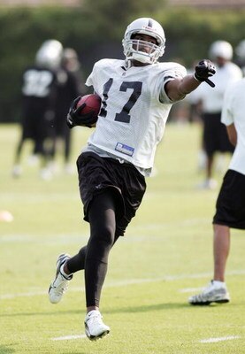NAPA, CA - JULY 25:  Javon Walker #17 lifts his hand as he runs with the ball during a morning session as the Oakland Raiders start their camp at the Marriott Hotel on July 25, 2008 in Napa, California. (Photo by Sara Wolfram/Getty Images)