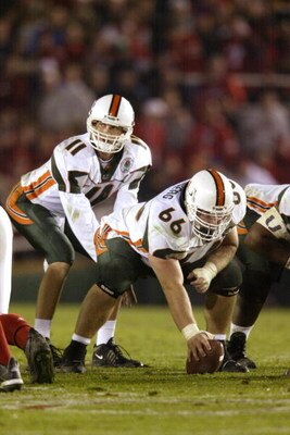 3 Jan 2002:  Quarterback Ken Dorsey #11 of Miami takes the snap from center Brett Romberg #66  during the Rose Bowl National Championship game against Nebraska at the Rose Bowl in Pasadena, California.  Miami won the game 37-14, winning the BCS and the Na