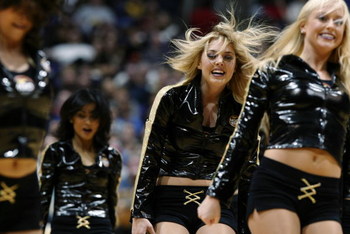 LOS ANGELES - DECEMBER 3: The Los Angeles Lakers cheerleaders perform during a break from the game against the Memphis Grizzlies at Staples Center on December 3, 2002 in Los Angeles, California. The Lakers won 101-91. NOTE TO USER: User expressly ackno