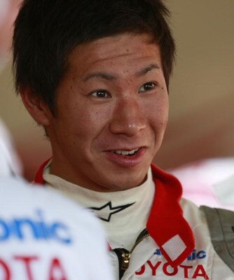 JEREZ DE LA FRONTERA, SPAIN - DECEMBER 05:   Kamui Kobayashi of Japan and the Toyota F-1 racing team chats in the team paddock during Formula One Testing at the Circuito de Jerez racetrack on December 5, 2007 in Jerez, Spain.  (Photo by Denis Doyle/Getty 