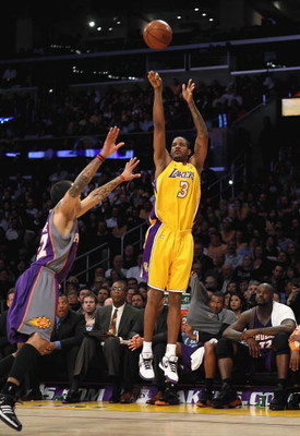 LOS ANGELES, CA - FEBRUARY 26: Trevor Ariza #3 of the Los Angeles Lakers shoots a three point shot over Matt Barnes #22 of the Phoenix Suns during the NBA game at Staples Center on February 26, 2009 in Los Angeles, California. The Lakers defeated the S