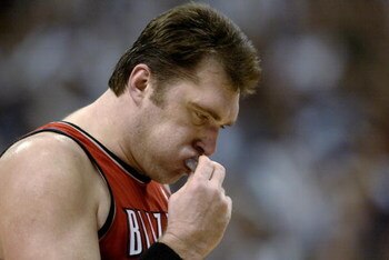 DALLAS - MAY 4:  Arvydas Sabonis #11 of the Portland Trail Blazers removes his mouth guard in Game seven of the Western Conference Quarterfinals against the Dallas Mavericks during the 2003 NBA Playoffs at American Airlines Center on May 4, 2003 in Dallas