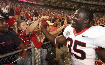 TUSCALOOSA, AL - SEPTEMBER 22: Linebacker Rennie Curran #35 of the Georgia Bulldogs celebrates with fans after defeating the Alabama Crimson Tide at Bryant-Denny Stadium September 22, 2007 in Tuscaloosa, Alabama. Georgia defeated Alabama 26-23 in overtime