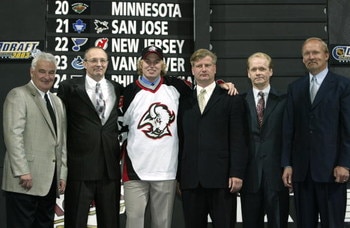 NASHVILLE, TN - JUNE 21:  (L to R) Sabers owner Thomas B. Golisano, Don Luce, Thomas Vanek, Jim Benning, general manager Darcy Regier and head coach Lindy Ruff of the Buffalo Sabres pose for a portrait on stage during the 2003 NHL Entry Draft at the Gaylo