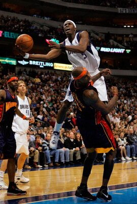 DALLAS - JANUARY 02:  Forward Josh Howard #5 of the Dallas Mavericks makes the shot and draws the foul by Al Harrington #3 of the Golden State Warriors on January 2, 2008 at American Airlines Center in Dallas, Texas.  NOTE TO USER: User expressly acknowle