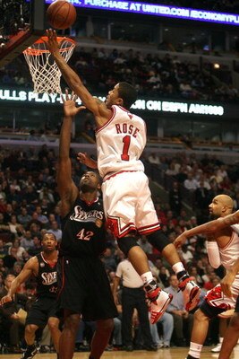 CHICAGO - DECEMBER 02:  Derrick Rose #1 of the Chicago Bulls drives for a shot attempt against Elton Brand #42 of the Philadelphia 76ers at the United Center on December 2, 2008 in Chicago, Illinois.  NOTE TO USER: User expressly acknowledges and agrees t