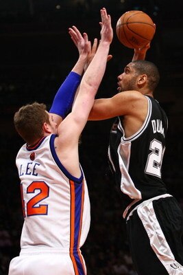 NEW YORK - FEBRUARY 17: Tim Duncan #21 of the San Antonio Spurs shoots over David Lee #42 of the New York Knicks at Madison Square Garden February 17, 2009 in New York City. The Knicks won the game in overtime 112-107. NOTE TO USER: User expressly acknowl