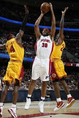 CLEVELAND - FEBRUARY 22:  Rasheed Wallace #30 of the Detroit Pistons gets a shot off between Ben Wallace #4 and LeBron James #23 of the Cleveland Cavaliers on February 22, 2009 at the Quicken Loans Arena in Cleveland, Ohio. Cleveland won the game 99-78. N