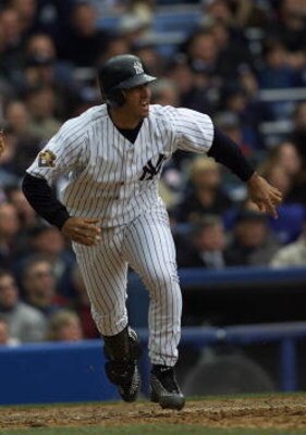 2 Apr 2001:  Jorge Posada #20 of the New York Yankees hits a home run against the Kansas City Royals on Opening Day at Yankee Stadium in Bronx, New York. The Yankees won 7-3.  Digital Image. Mandatory Credit: Jamie Squire/ALLSPORT