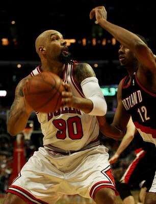 CHICAGO - JANUARY 12: Drew Gooden #90 of the Chicago Bulls moves to the basket against LaMarcus Aldridge #12 of the Portland Trail Blazers on January 12, 2009 at the United Center in Chicago, Illinois. The Trail Blazers defeated the Bulls 109-95. NOTE TO 