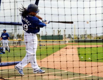 GLENDALE, AZ - MARCH 05:  Manny Ramirez #99 of the Los Angeles Dodgers hits during batting practice before a spring training game against the Chicago White Sox on March 5, 2009, at Camelback Ranch in Glendale, Arizona.  Ramirez signed a $45million two-yea