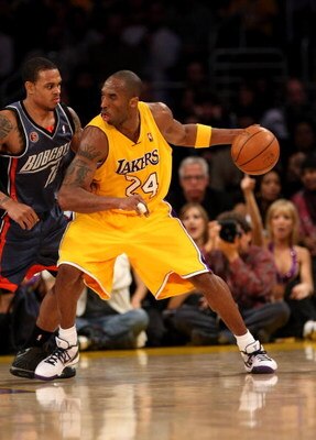 LOS ANGELES - JANUARY 27:  Kobe Bryant #24 of the Los Angeles Lakers controls the ball against Shannon Brown #12 of the Charlotte Bobcats on January 27, 2009 at Staples Center in Los Angeles, California.  The Bobcats won 117-110 in double overtime.  NOTE 
