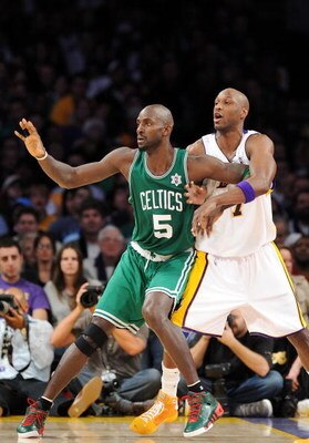 LOS ANGELES, CA - DECEMBER 25:  Kevin Garnett #5 of the Boston Celtics and Lamar Odom #7 of the Los Angeles Lakers battle for position during the game at Staples Center on December 25, 2008 in Los Angeles, California.  The Lakers defeated the Celtics 92-8